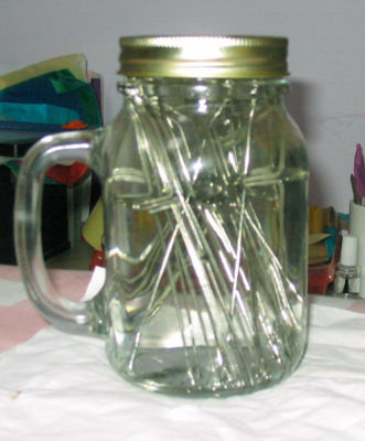 needles in surgical spirit in a jar